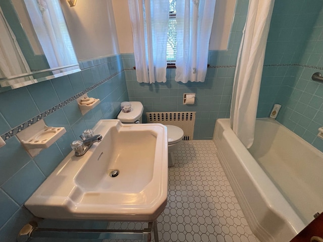 985 Ostrander Ave, Riverhead, NY 11901 - full bathroom with tile walls, shower / bath combination with curtain, and a wainscoted wall