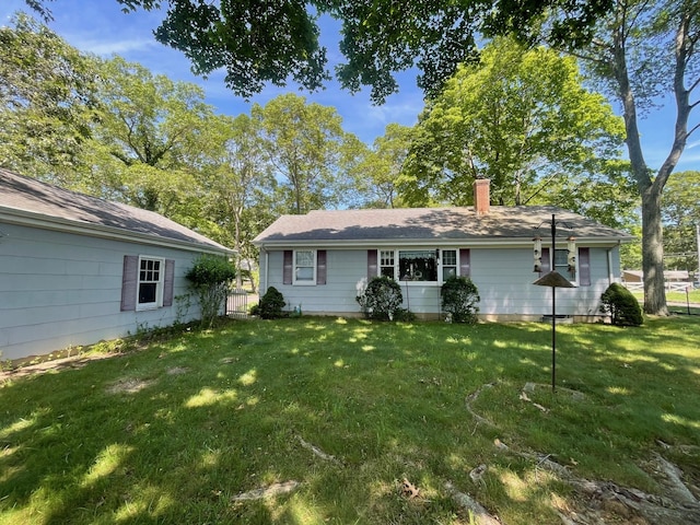 985 Ostrander Ave, Riverhead, NY 11901 - back of property featuring a chimney