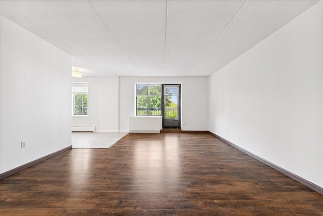 50 Columbus Ave Unit 611, Tuckahoe, NY 10707 - unfurnished room with a baseboard heating unit and wood finished floors