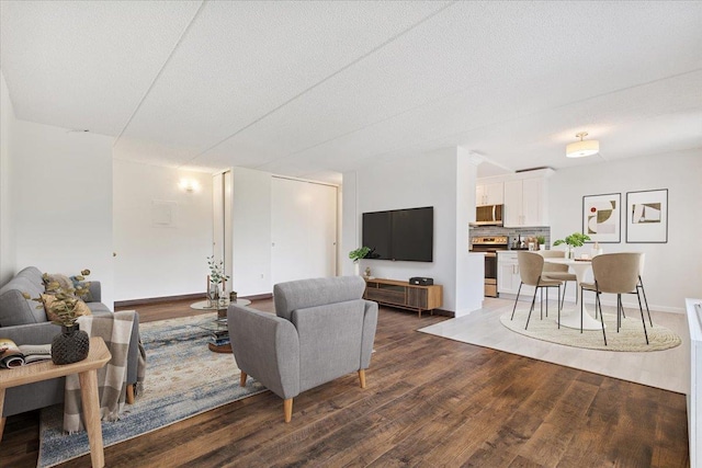 50 Columbus Ave Unit 611, Tuckahoe, NY 10707 - living area featuring dark wood finished floors and a textured ceiling
