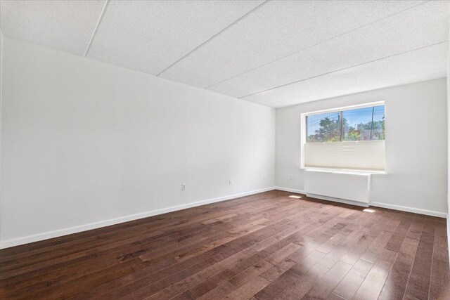 50 Columbus Ave Unit 611, Tuckahoe, NY 10707 - spare room featuring dark wood-style flooring and a textured ceiling
