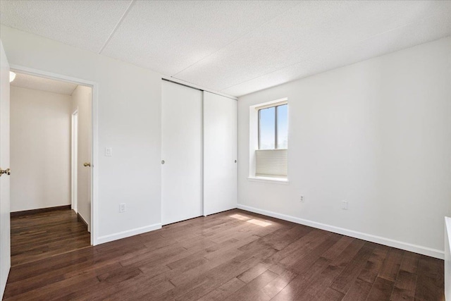50 Columbus Ave Unit 611, Tuckahoe, NY 10707 - unfurnished bedroom with dark wood-type flooring and a closet