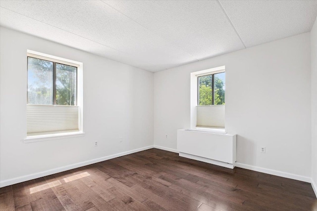 50 Columbus Ave Unit 611, Tuckahoe, NY 10707 - spare room featuring dark wood-type flooring, plenty of natural light, and a textured ceiling
