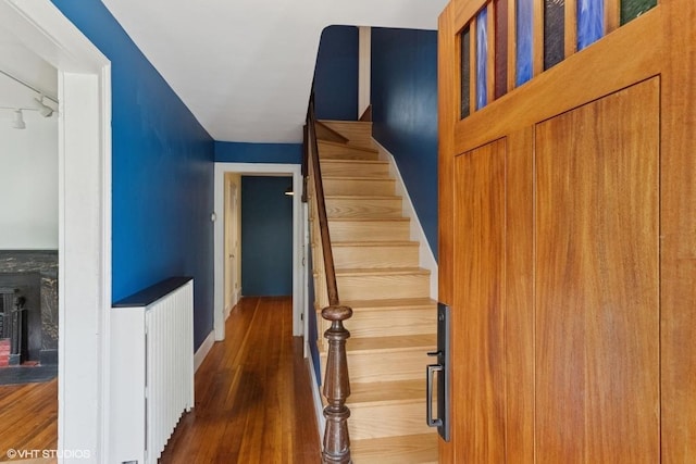 4 Dewindt St, Beacon, NY 12508 - staircase with wood finished floors and a fireplace