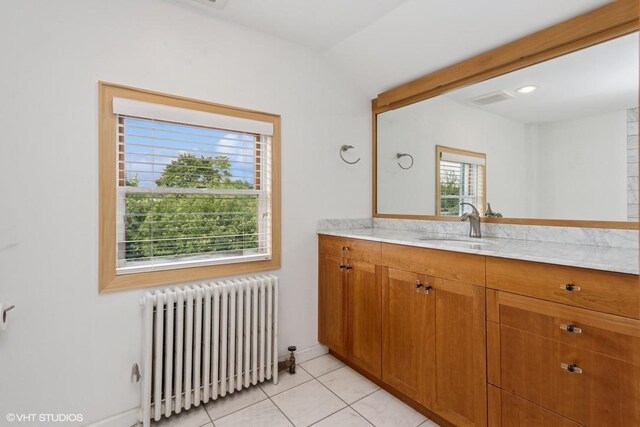 4 Dewindt St, Beacon, NY 12508 - bathroom featuring radiator heating unit, vanity, tile patterned floors, and vaulted ceiling