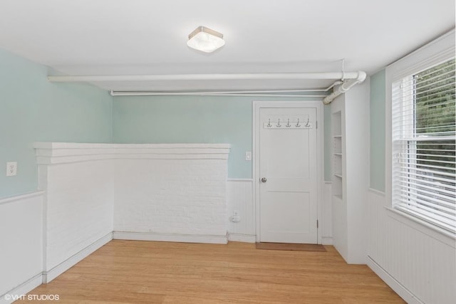 4 Dewindt St, Beacon, NY 12508 - spare room with wainscoting and light wood finished floors