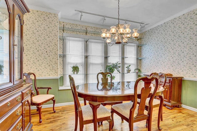 313 Pine St, Freeport, NY 11520 - dining area with wallpapered walls, wainscoting, light wood-type flooring, rail lighting, and crown molding