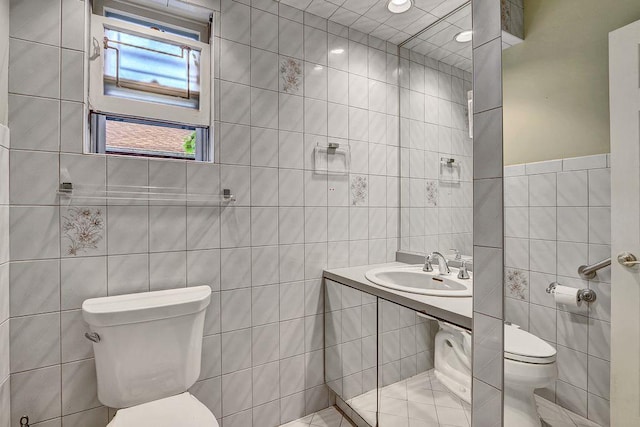 313 Pine St, Freeport, NY 11520 - bathroom featuring toilet and tile walls