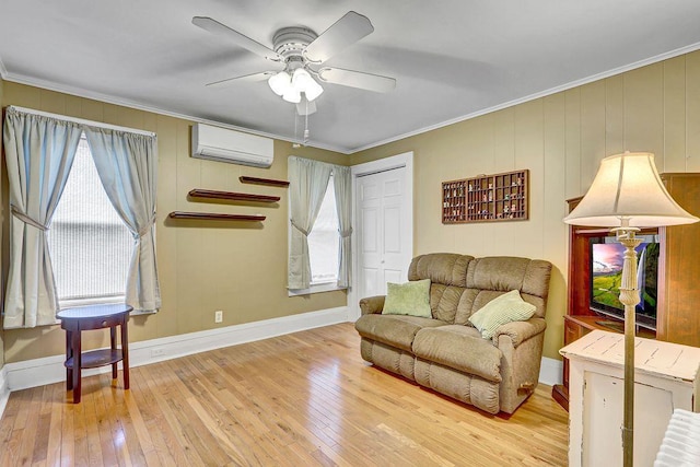 313 Pine St, Freeport, NY 11520 - living area with a wall mounted AC, hardwood / wood-style flooring, ceiling fan, healthy amount of natural light, and ornamental molding