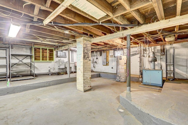 313 Pine St, Freeport, NY 11520 - unfinished below grade area with gas water heater, electric panel, and a heating unit