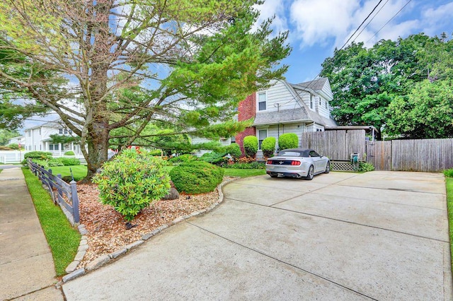 313 Pine St, Freeport, NY 11520 - view of property exterior with concrete driveway