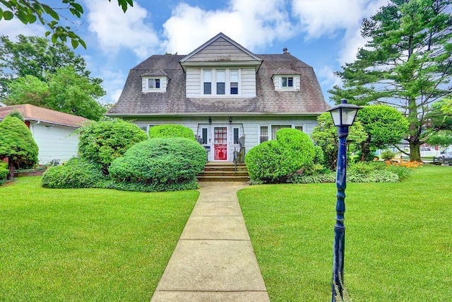 313 Pine St, Freeport, NY 11520 - view of front of house with a front yard and roof with shingles