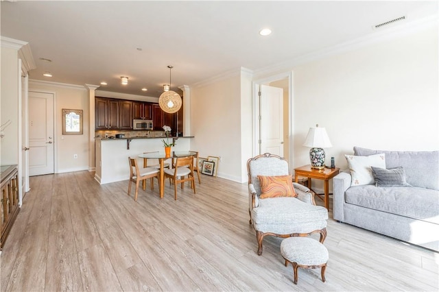 1 Christie Pl Unit 205E, Scarsdale, NY 10583 - living area featuring crown molding, recessed lighting, and light wood finished floors