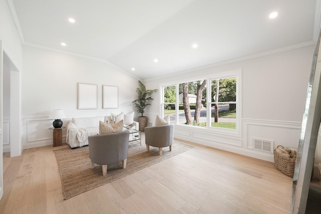 2 Danby Pl, Yonkers, NY 10710 - living area with crown molding, light wood finished floors, a wainscoted wall, vaulted ceiling, and a decorative wall