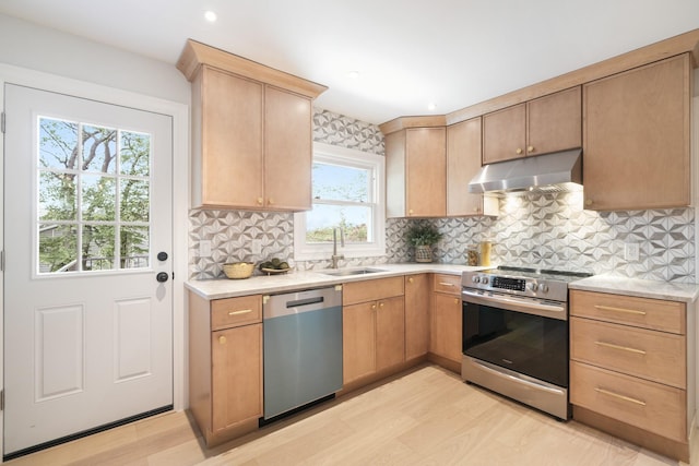 2 Danby Pl, Yonkers, NY 10710 - kitchen with stainless steel appliances, under cabinet range hood, light countertops, tasteful backsplash, and recessed lighting