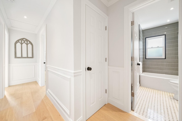 2 Danby Pl, Yonkers, NY 10710 - hallway featuring light wood-type flooring, a decorative wall, wainscoting, and crown molding