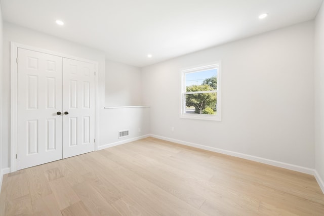 2 Danby Pl, Yonkers, NY 10710 - unfurnished bedroom featuring light wood-style floors, a closet, and recessed lighting