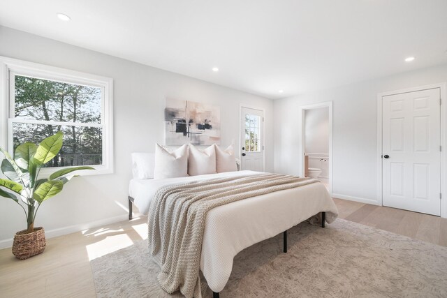 2 Danby Pl, Yonkers, NY 10710 - bedroom with multiple windows, wood finished floors, recessed lighting, and ensuite bathroom