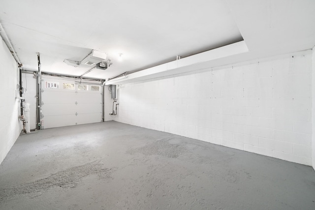 2 Danby Pl, Yonkers, NY 10710 - garage featuring a garage door opener, concrete block wall, and electric panel