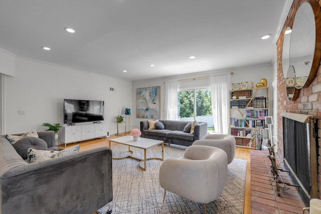 94 Fairview Ave, Great Neck, NY 11023 - living room with a brick fireplace, ornamental molding, recessed lighting, and wood finished floors