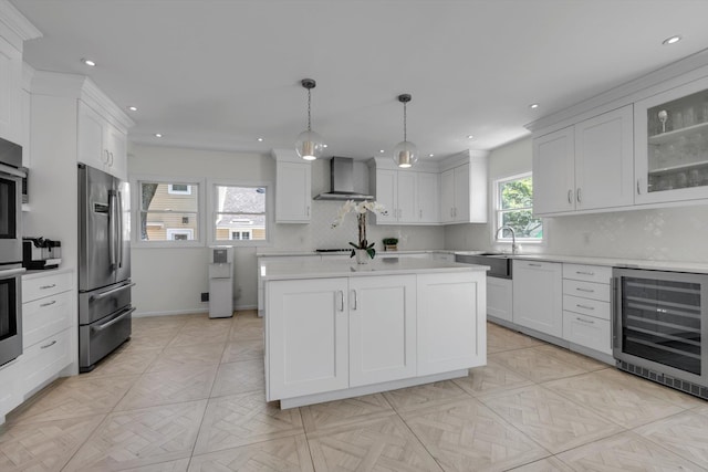 94 Fairview Ave, Great Neck, NY 11023 - kitchen featuring wine cooler, stainless steel refrigerator, wall chimney exhaust hood, light countertops, and tasteful backsplash