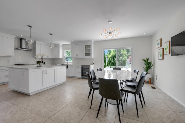 94 Fairview Ave, Great Neck, NY 11023 - dining space with beverage cooler, recessed lighting, and a chandelier