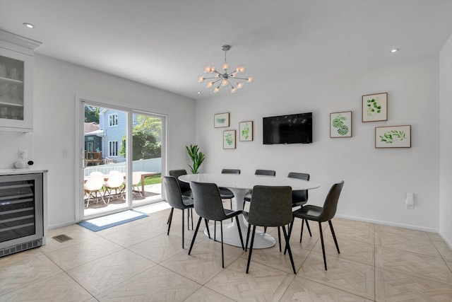 94 Fairview Ave, Great Neck, NY 11023 - dining area featuring wine cooler, a chandelier, and recessed lighting