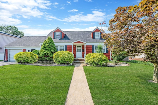 694 Koelbel Ct, Baldwin, NY 11510 - new england style home with a shingled roof, a front yard, and an attached garage