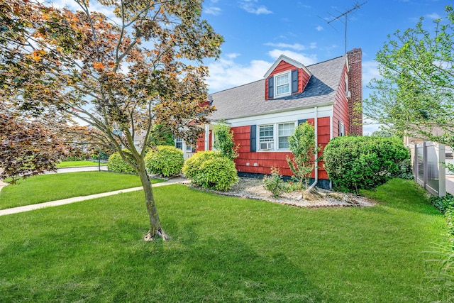 694 Koelbel Ct, Baldwin, NY 11510 - view of front facade with a chimney, roof with shingles, and a front yard