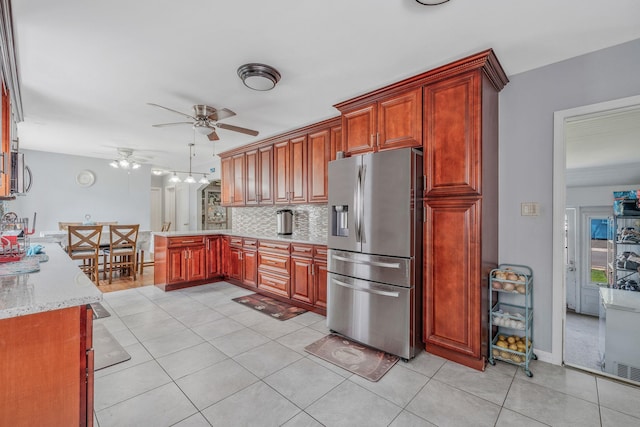 694 Koelbel Ct, Baldwin, NY 11510 - kitchen featuring stainless steel appliances, ceiling fan, light tile patterned flooring, and a peninsula