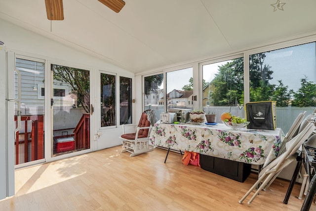 694 Koelbel Ct, Baldwin, NY 11510 - sunroom with wood finished floors, vaulted ceiling, and a deck