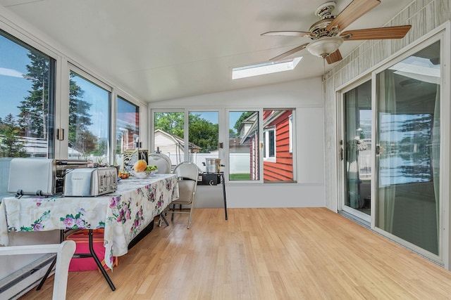 694 Koelbel Ct, Baldwin, NY 11510 - sunroom with wood finished floors, lofted ceiling, a skylight, and a wooden deck