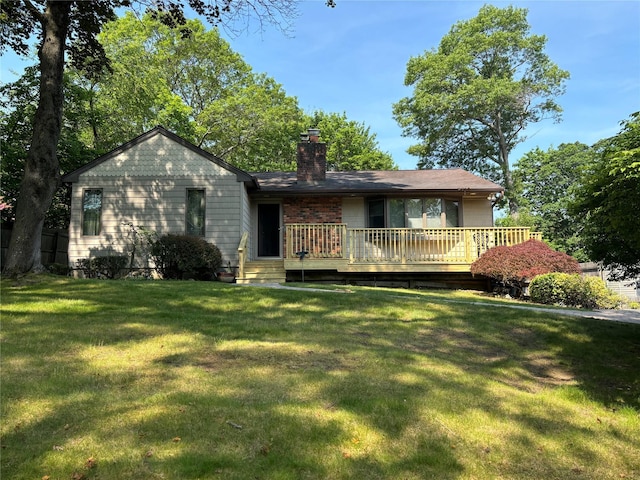 266 Adirondack Dr, Selden, NY 11784 - back of property with a chimney, a yard, and a wooden deck