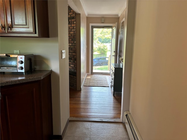266 Adirondack Dr, Selden, NY 11784 - doorway with ornamental molding and a baseboard heating unit