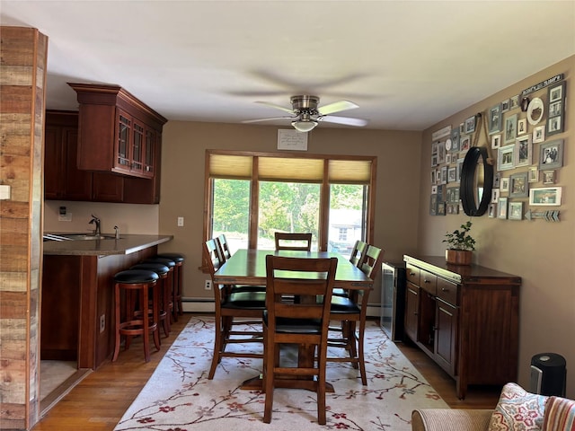 266 Adirondack Dr, Selden, NY 11784 - dining room with a ceiling fan, light wood-style flooring, and a baseboard heating unit