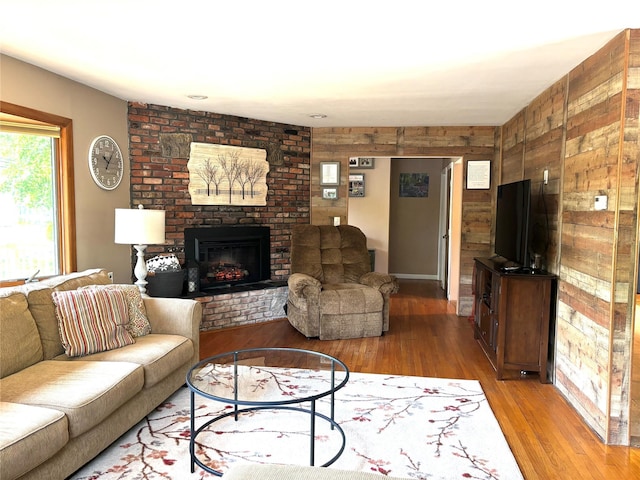 266 Adirondack Dr, Selden, NY 11784 - living area with light wood-type flooring and a brick fireplace