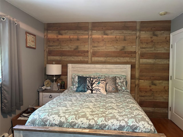 266 Adirondack Dr, Selden, NY 11784 - bedroom featuring wood walls, wood finished floors, and a baseboard heating unit