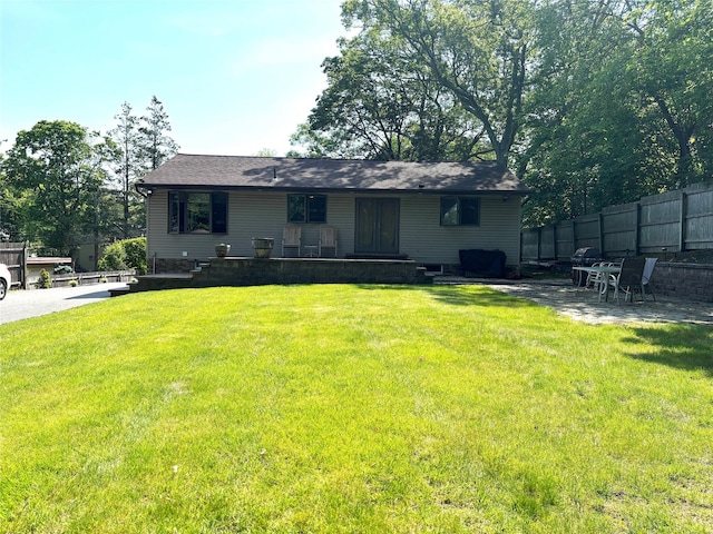 266 Adirondack Dr, Selden, NY 11784 - back of property with a patio area