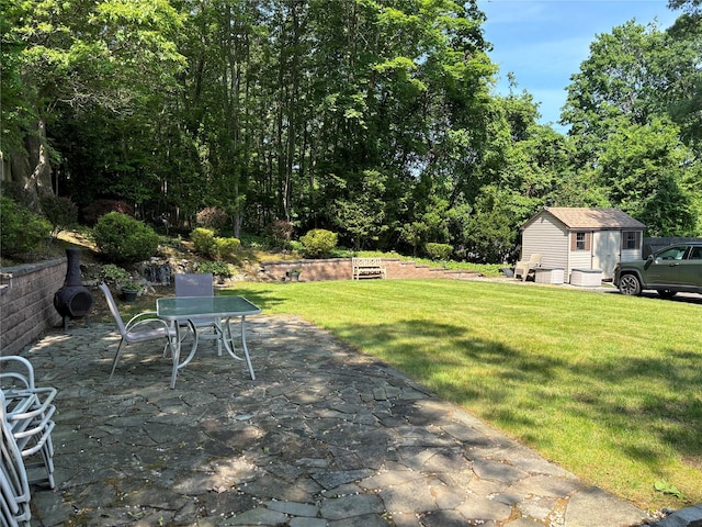 266 Adirondack Dr, Selden, NY 11784 - view of green lawn featuring a patio, a storage unit, and outdoor dining area