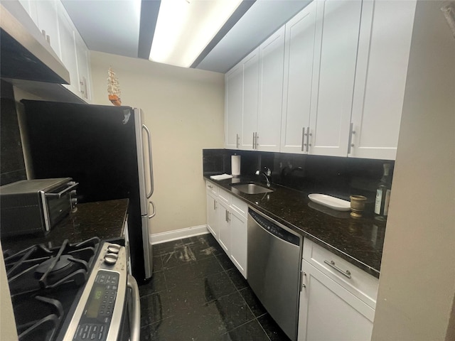 360 Central Ave Unit 217, Lawrence, NY 11559 - kitchen featuring stainless steel appliances, white cabinetry, and dark stone countertops