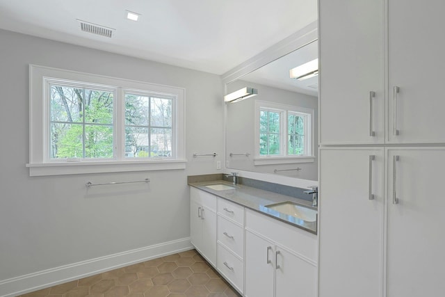 1 Devoe Rd, Armonk, NY 10504 - bathroom with plenty of natural light, double vanity, and tile patterned flooring