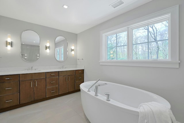 1 Devoe Rd, Armonk, NY 10504 - full bath featuring a freestanding tub, double vanity, and tile patterned floors