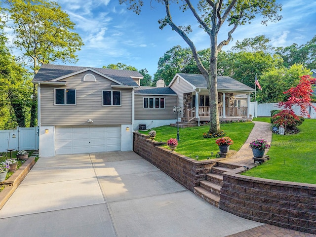 6 Sunrise Pl, Farmingville, NY 11738 - single story home with a porch, concrete driveway, a garage, a gate, and a chimney