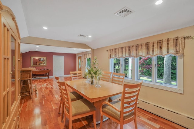 6 Sunrise Pl, Farmingville, NY 11738 - dining room featuring baseboard heating, light wood-style flooring, recessed lighting, and lofted ceiling