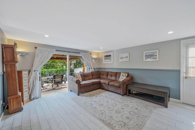 6 Sunrise Pl, Farmingville, NY 11738 - living area featuring healthy amount of natural light, light wood-style flooring, a wall unit AC, and recessed lighting