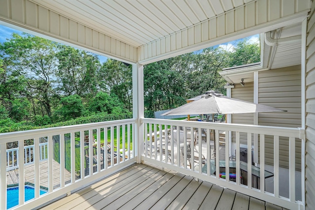 6 Sunrise Pl, Farmingville, NY 11738 - wooden deck with an outdoor pool and view of scattered trees