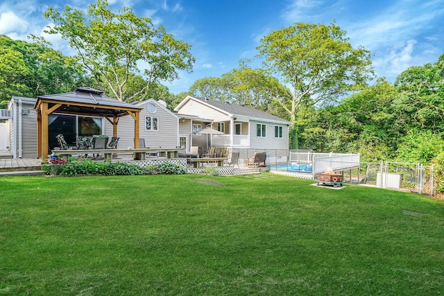 6 Sunrise Pl, Farmingville, NY 11738 - rear view of house featuring a gazebo, an outdoor fire pit, and a wooden deck