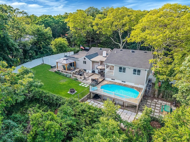 6 Sunrise Pl, Farmingville, NY 11738 - view of pool with a wooden deck, a fenced backyard, and a fire pit
