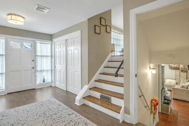 92 Wiltshire Rd, Scarsdale, NY 10583 - foyer entrance with wood finished floors and stairway