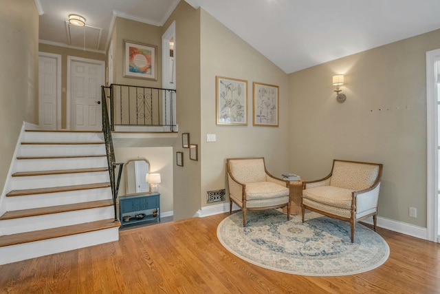 92 Wiltshire Rd, Scarsdale, NY 10583 - living area featuring wood finished floors, attic access, lofted ceiling, crown molding, and stairway